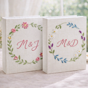 Personalized floral wreath hand embroidered photo album with custom initials on linen cover