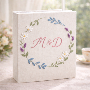 Personalized floral wreath hand embroidered photo album with custom initials on linen cover
