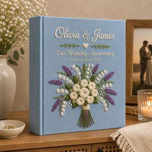 Personalized lavender lily bouquet hand embroidered photo album with custom names and anniversary date on linen cover