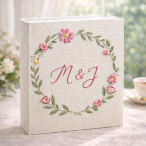 Personalized floral wreath hand embroidered photo album with custom initials on linen cover