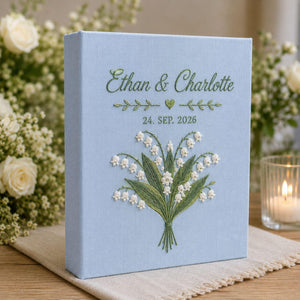 Personalized lily of the valley hand embroidered photo album with custom names and wedding date on linen cover