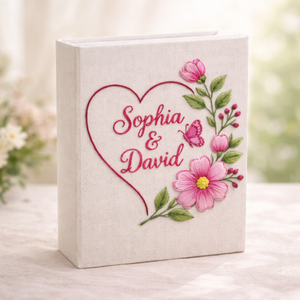Personalized pink floral wreath hand embroidered photo album with butterfly accent and custom names on linen cover