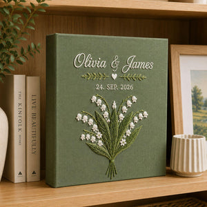 Personalized lily of the valley hand embroidered photo album with custom names and wedding date on linen cover