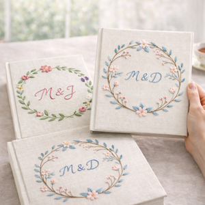 Personalized floral wreath hand embroidered photo album with custom initials on linen cover