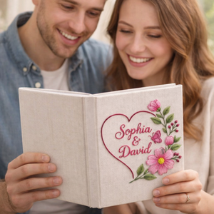Personalized pink floral wreath hand embroidered photo album with butterfly accent and custom names on linen cover