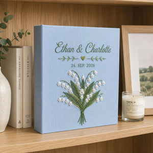 Personalized lily of the valley hand embroidered photo album with custom names and wedding date on linen cover