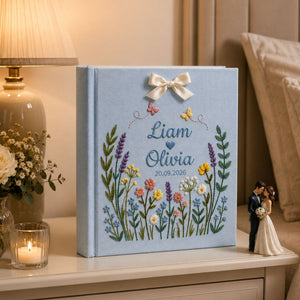 Personalized wildflower meadow hand embroidered photo album with custom names date butterflies and ribbon bow on linen cover