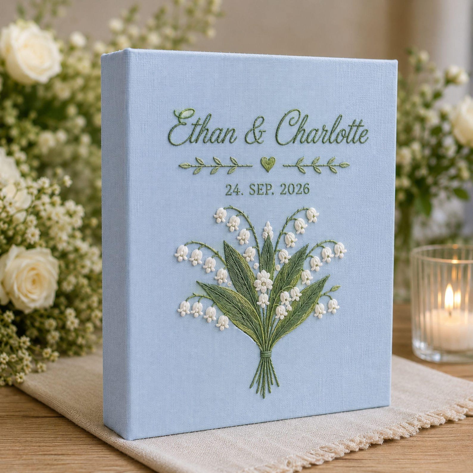 Personalized lily of the valley hand embroidered photo album with custom names and wedding date on linen cover