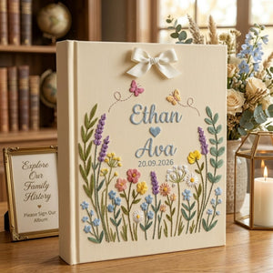 Personalized wildflower meadow hand embroidered photo album with custom names date butterflies and ribbon bow on linen cover